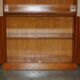 Open library Bradley Furniture made of yew wood with a cupboard base.