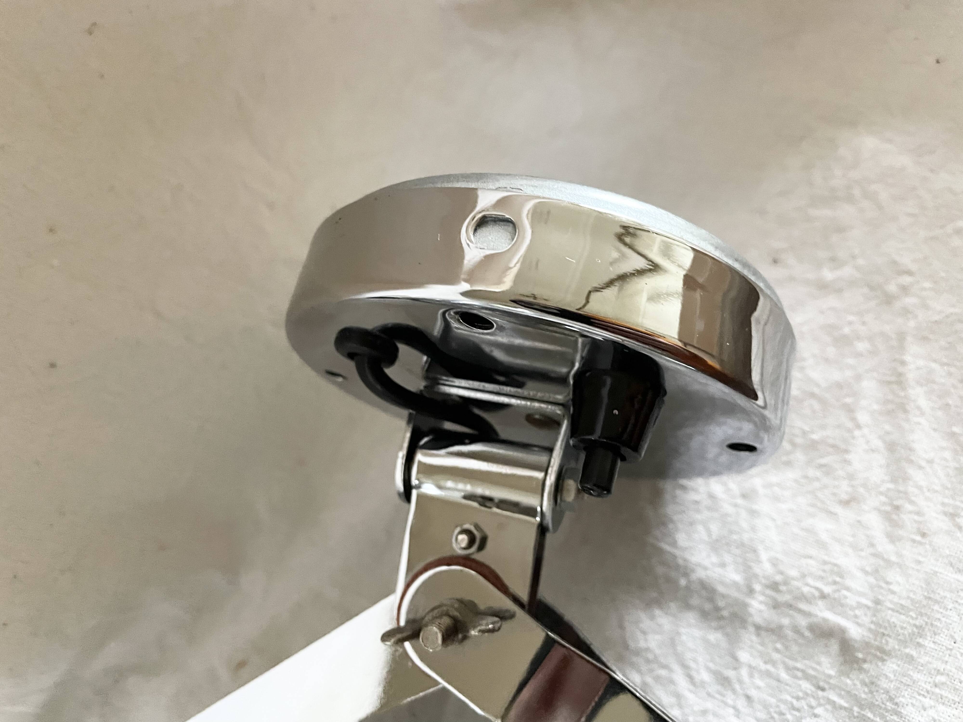 Vintage accordion wall light in chrome metal.