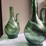 Pair of blown glass wine decanters in blue/green hues.