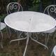Mategot-style perforated wrought iron garden furniture with table and armchairs