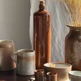 Large antique stoneware bottle with a small cork stopper