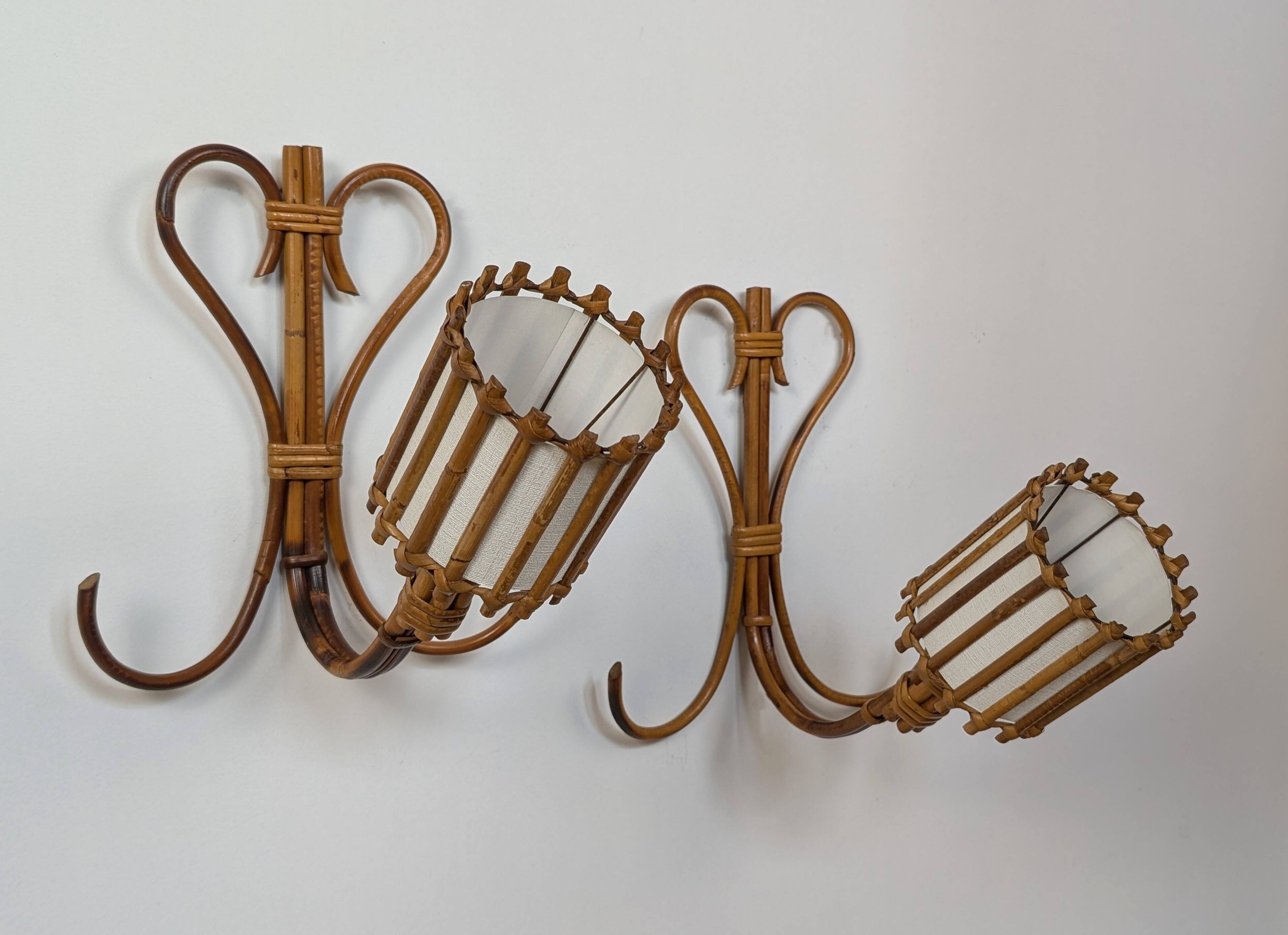 Rattan wall lights by Louis Sognot
