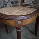 Set of 6 antique Louis XVI style dining chairs with caning.