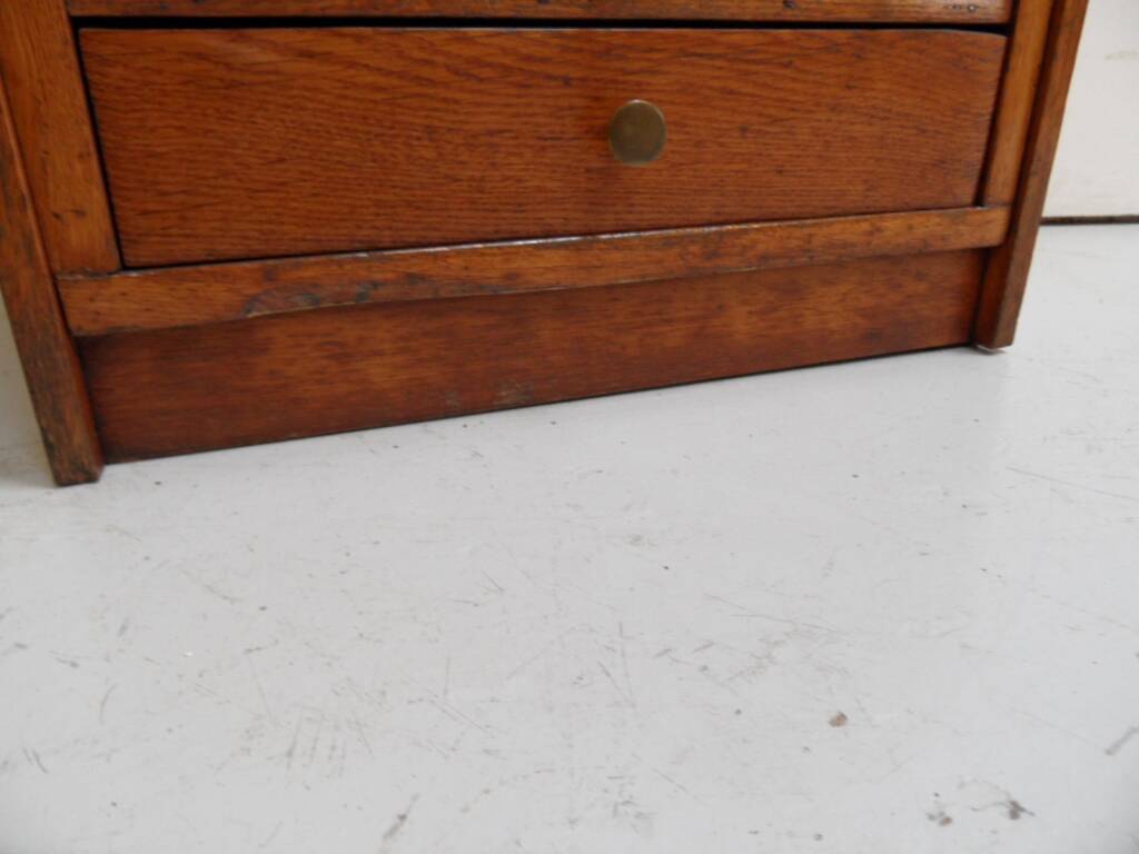 Antique oak watchmakers cabinet with drawers