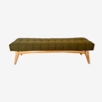 Wooden bench and green fabric