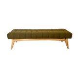 Wooden bench and green fabric