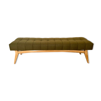 Wooden bench and green fabric