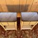 Pair of Louis XVI style bedside tables painted white.