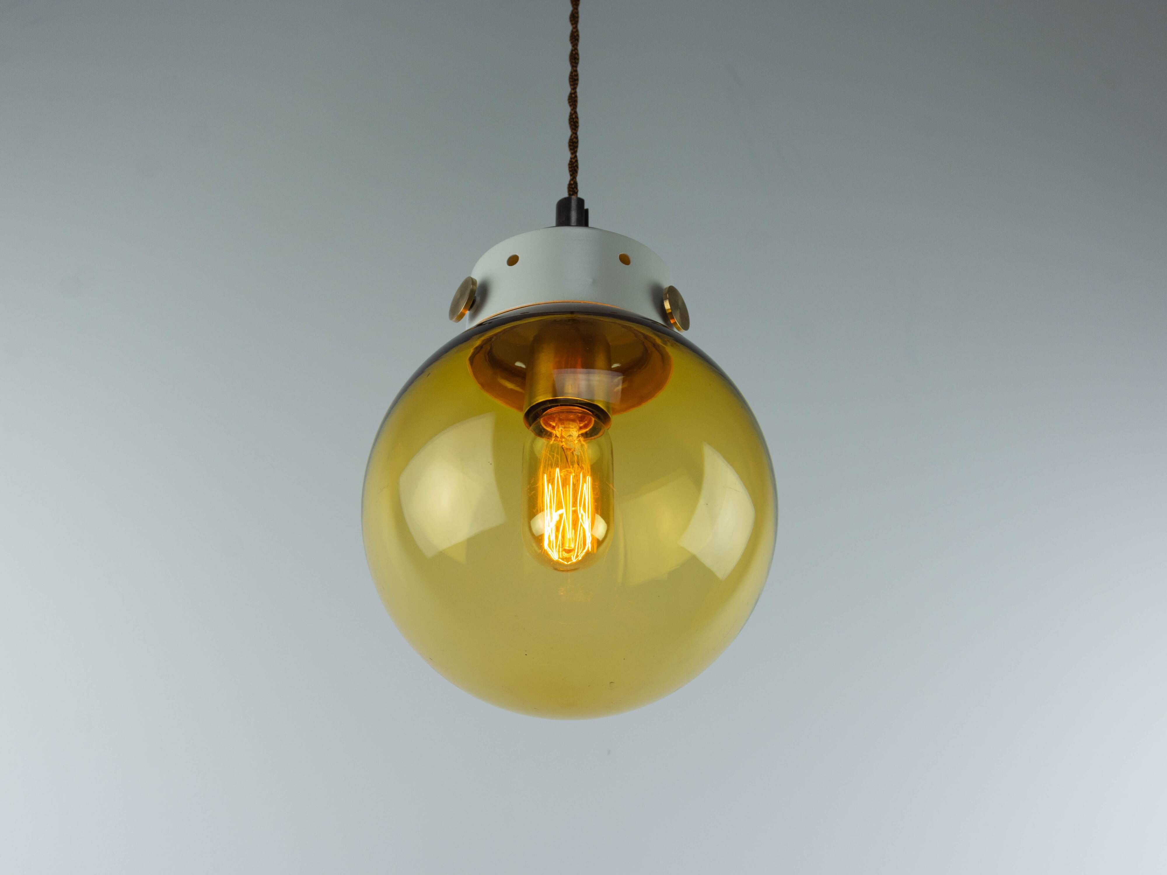 Vintage Mid-Century Modern Industrial Amber Glass And Brass Metal Lamp