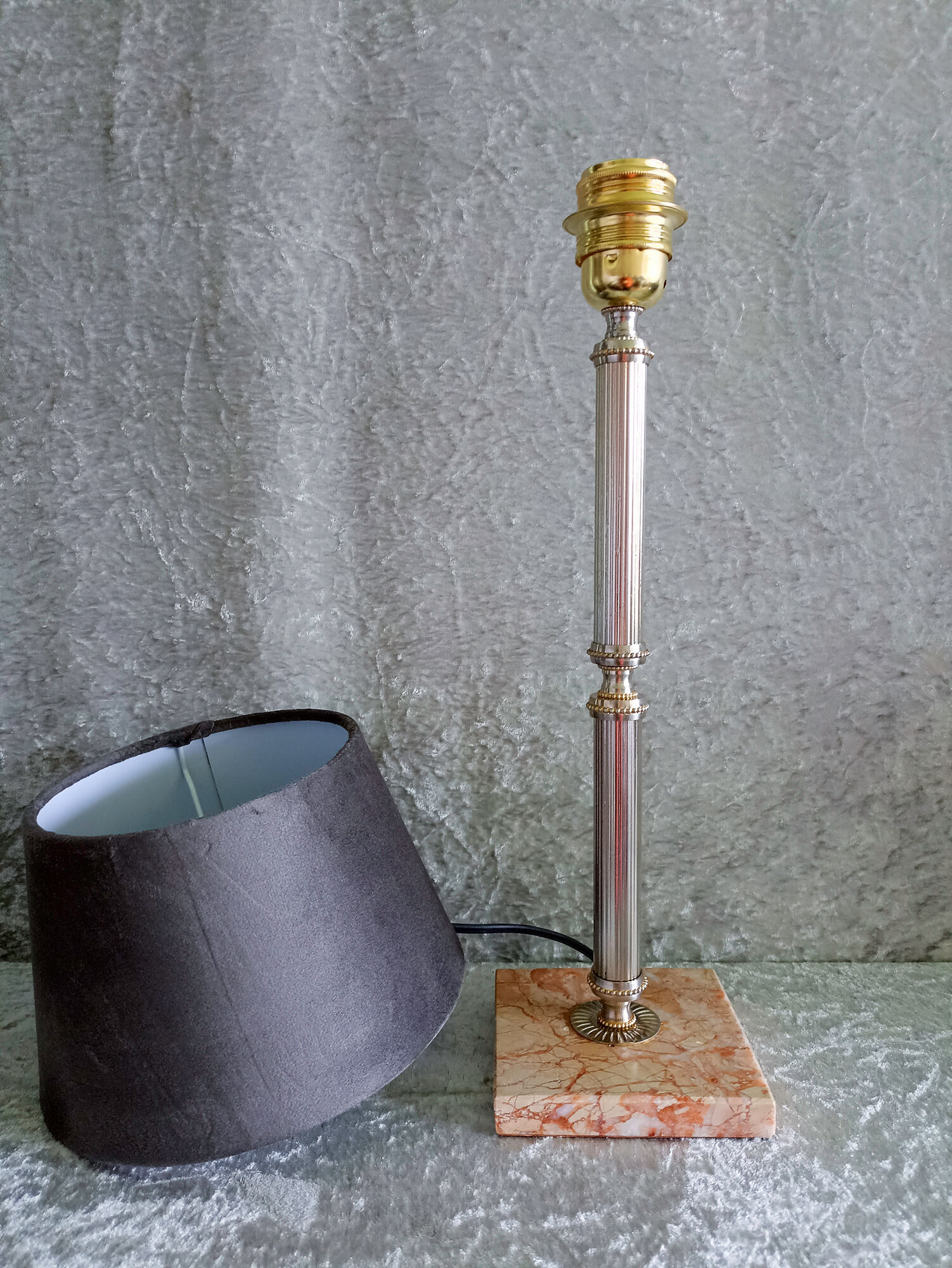 Golden metal lamp with pink marble base