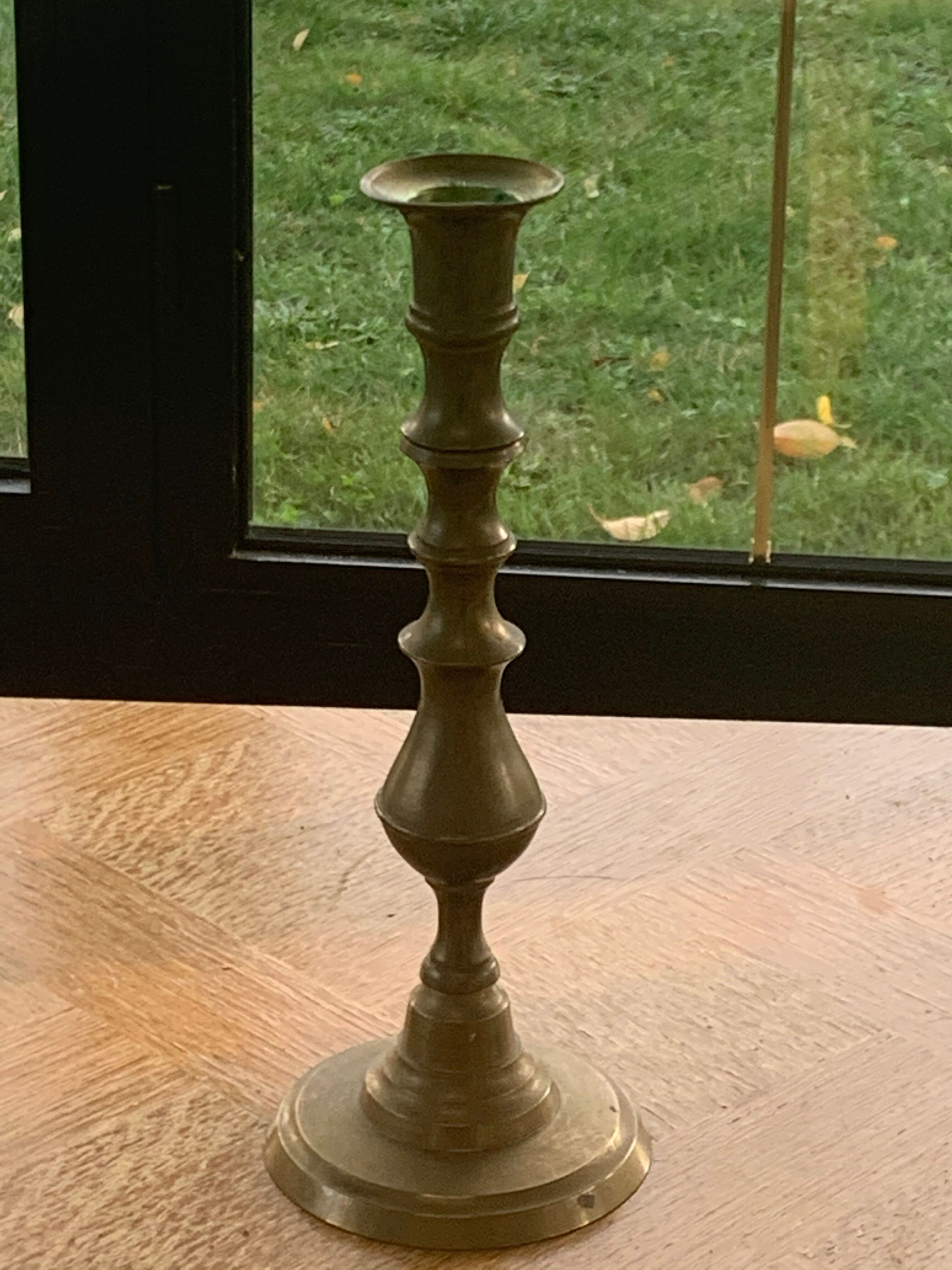 Brass candlestick, gold metal turns and chiseled original and vintage