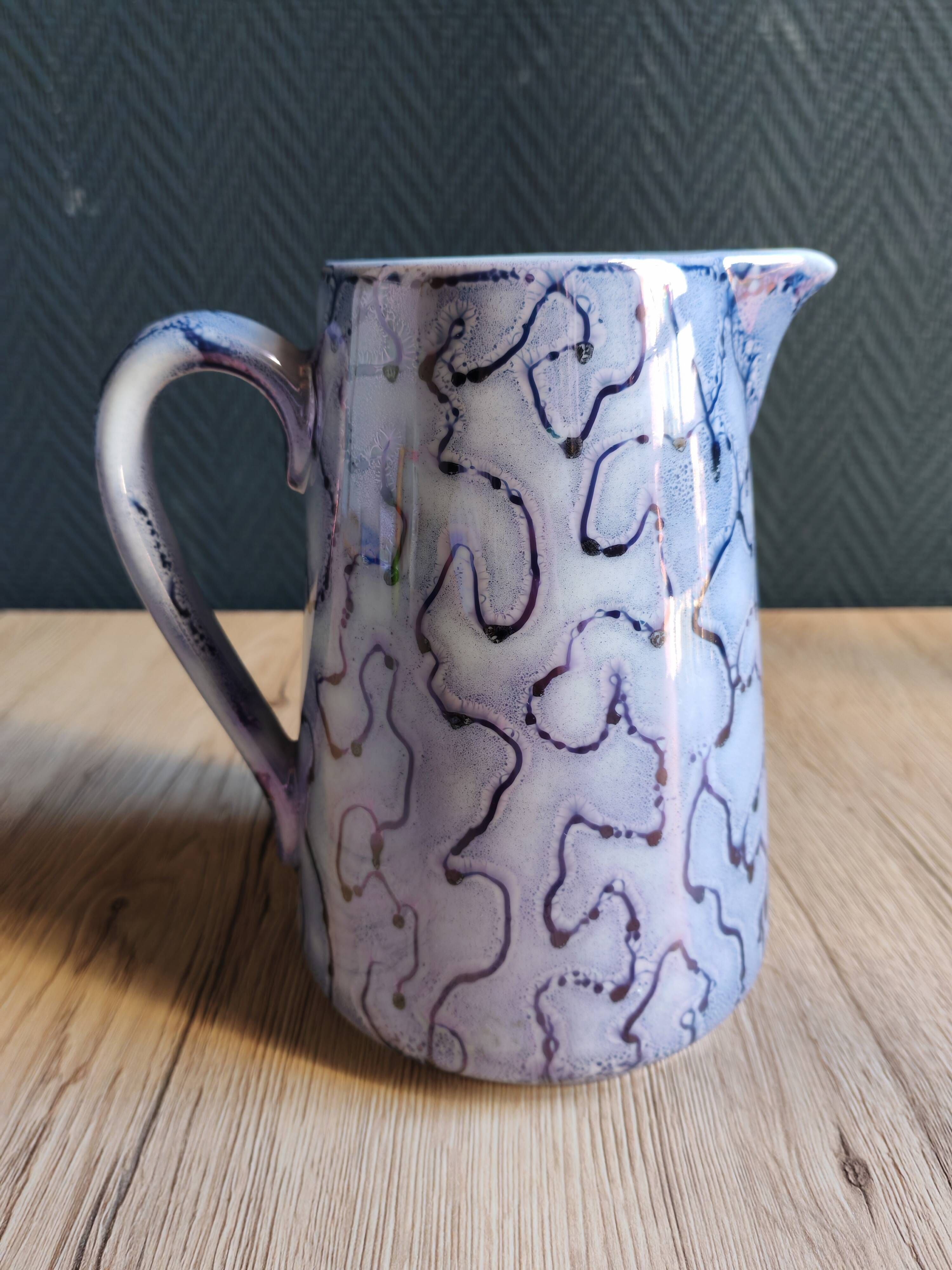 Vintage porcelain pitcher Lusseray France, decorated with grape clusters.