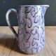 Vintage porcelain pitcher Lusseray France, decorated with grape clusters.