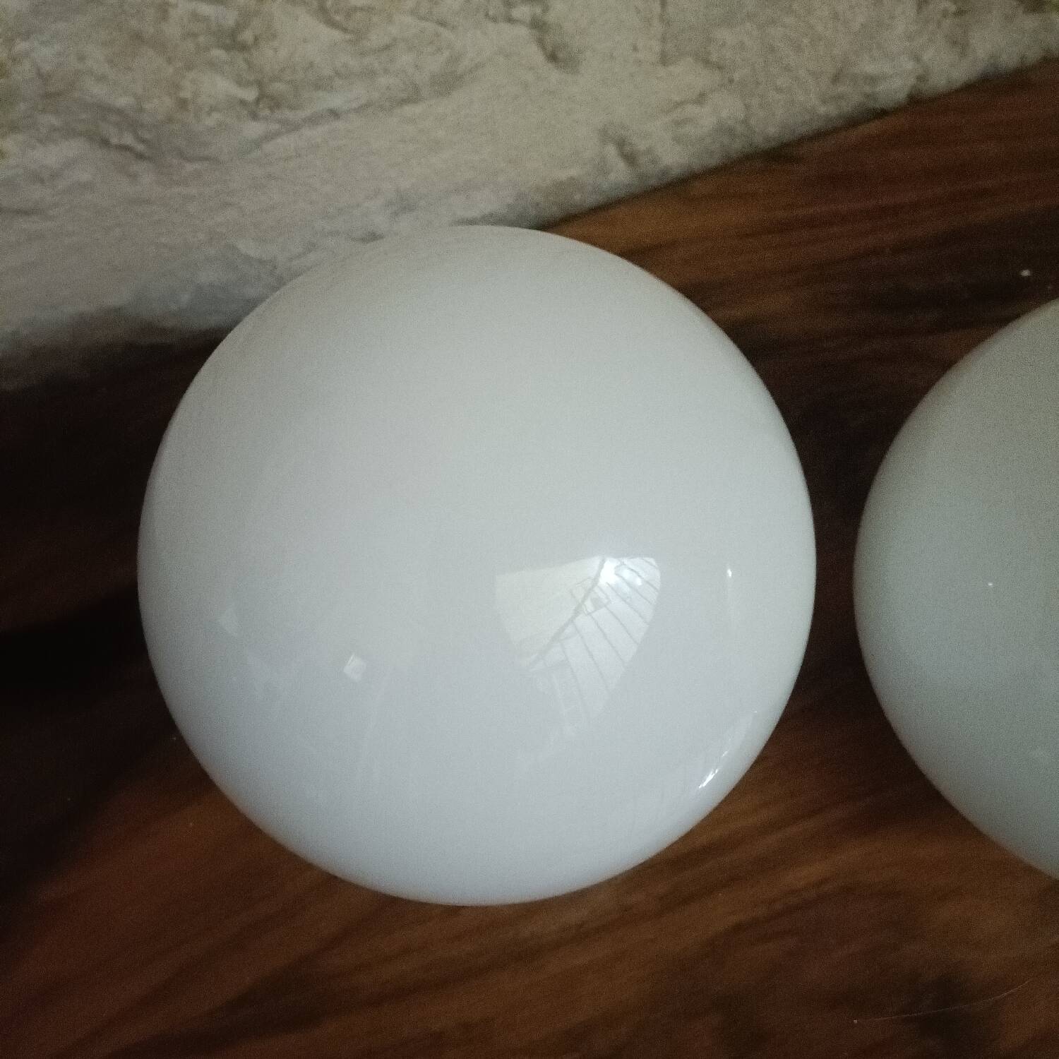 Pair of spherical lampshades in opaline.