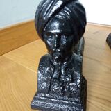 Cast iron andirons with character heads