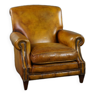 Large cowhide armchair on wheels