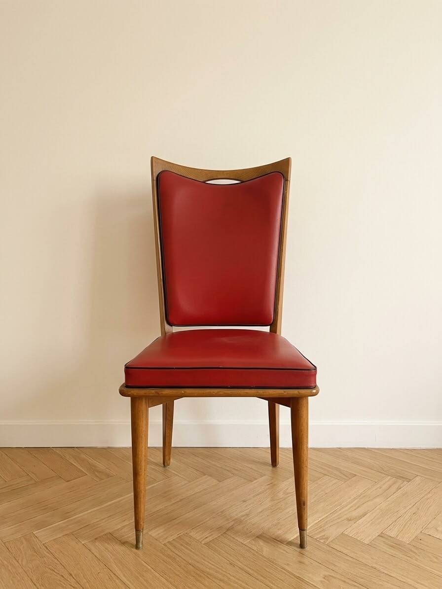Set of 6 vintage wooden chairs with red faux leather in retro style.