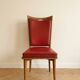 Set of 6 vintage wooden chairs with red faux leather in retro style.