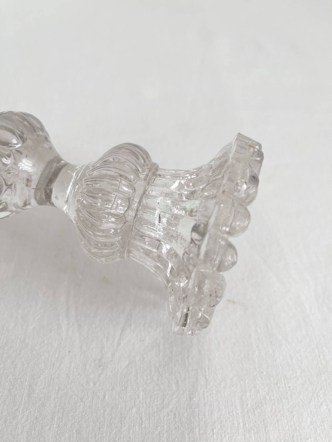 Antique baluster-shaped molded glass candlestick holder
