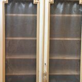 Bookcase 2 painted in ochre and cream mesh doors beginning 20 th