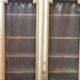 Bookcase 2 painted in ochre and cream mesh doors beginning 20 th