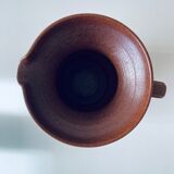 Old pitcher in glazed terracotta