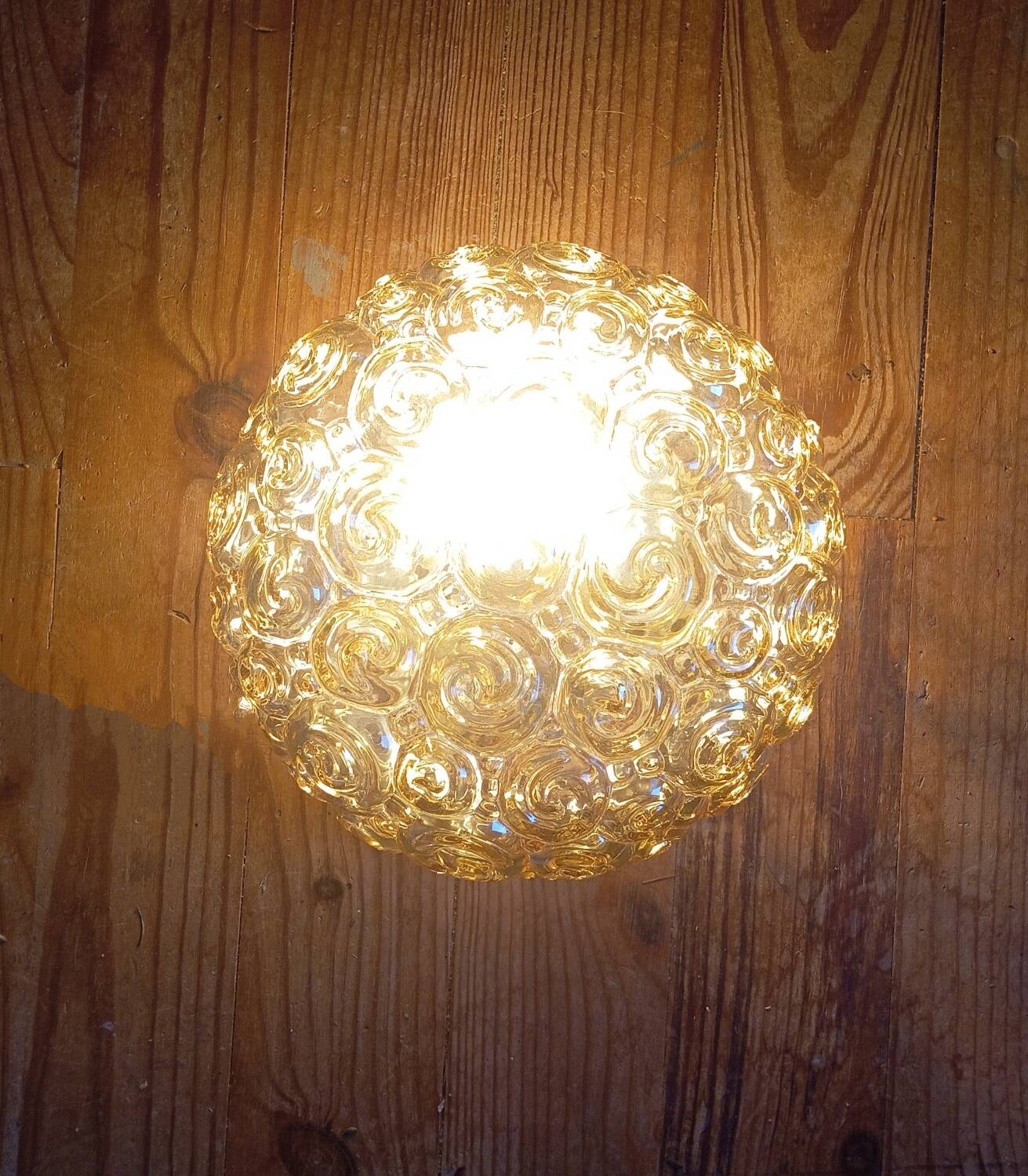 Héléna Tynell snail ceiling / wall light, iridescent amber 1960