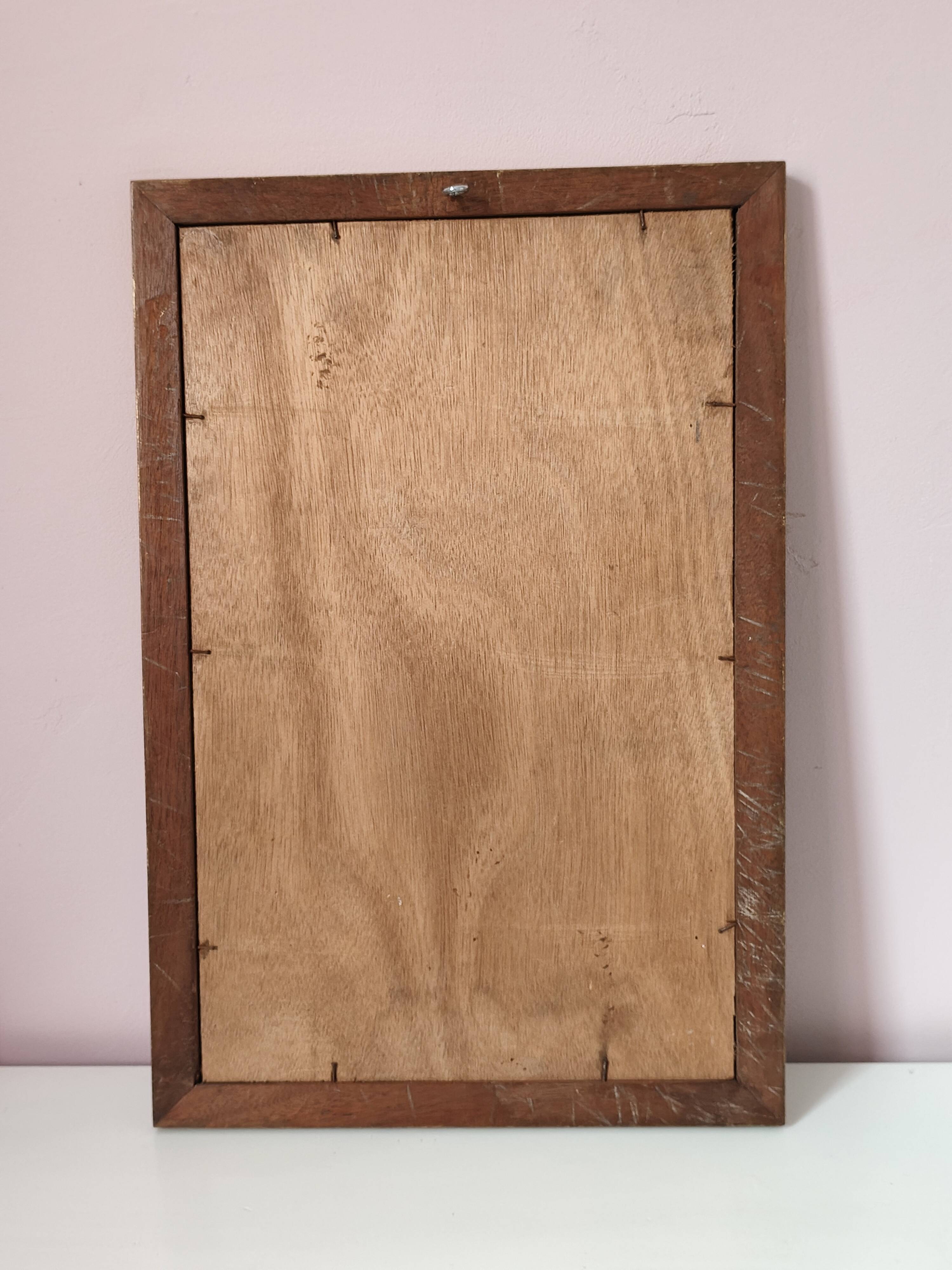 Petit miroir ancien en bois doré et glace biseautée