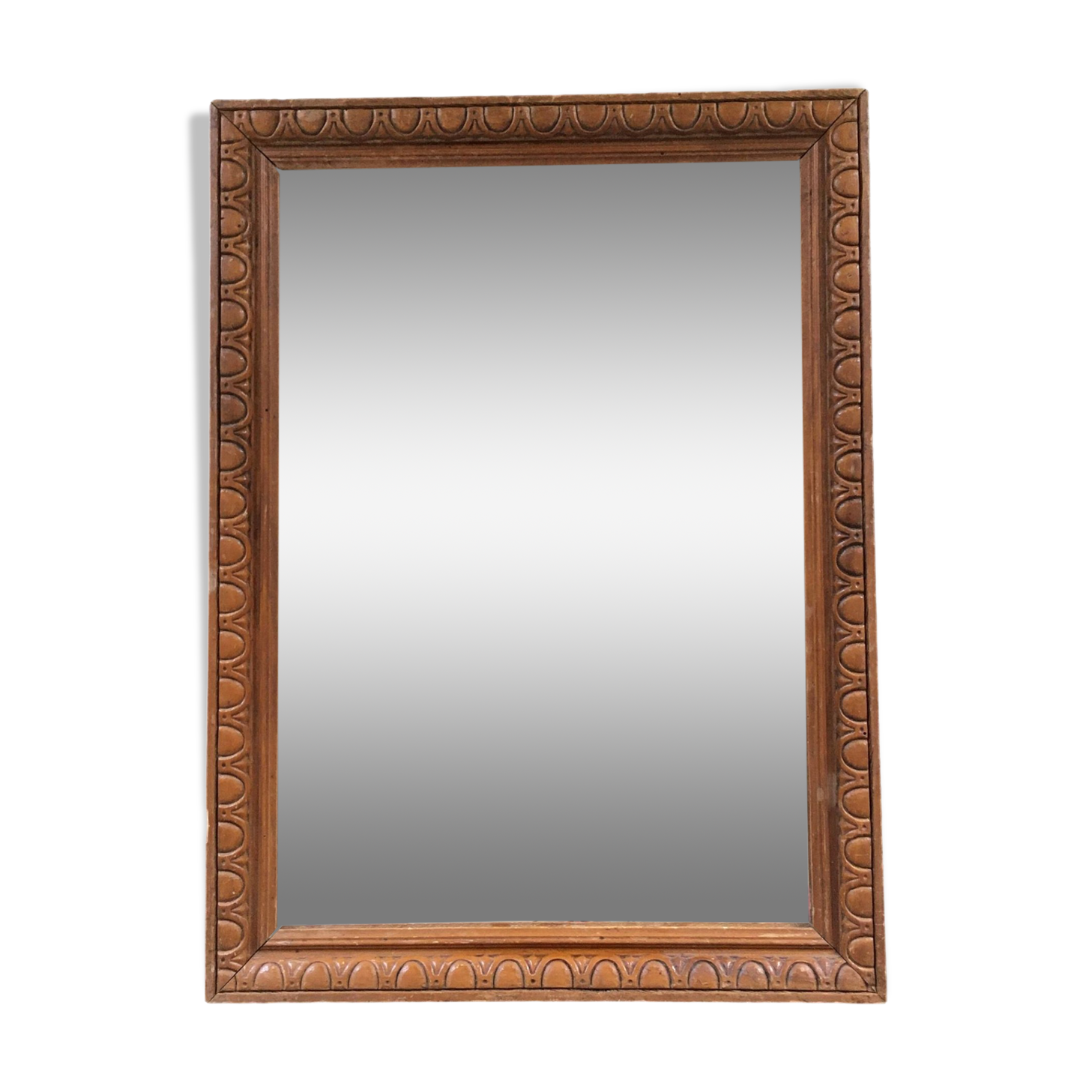 Antique mirror in ornate wood