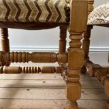 Pair of wooden chairs with herringbone fabric