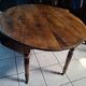 Oval table with folding leaves