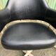 Pair of vintage armchairs in black skai with metal legs.
