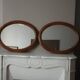 Paire de miroirs anciens ovales