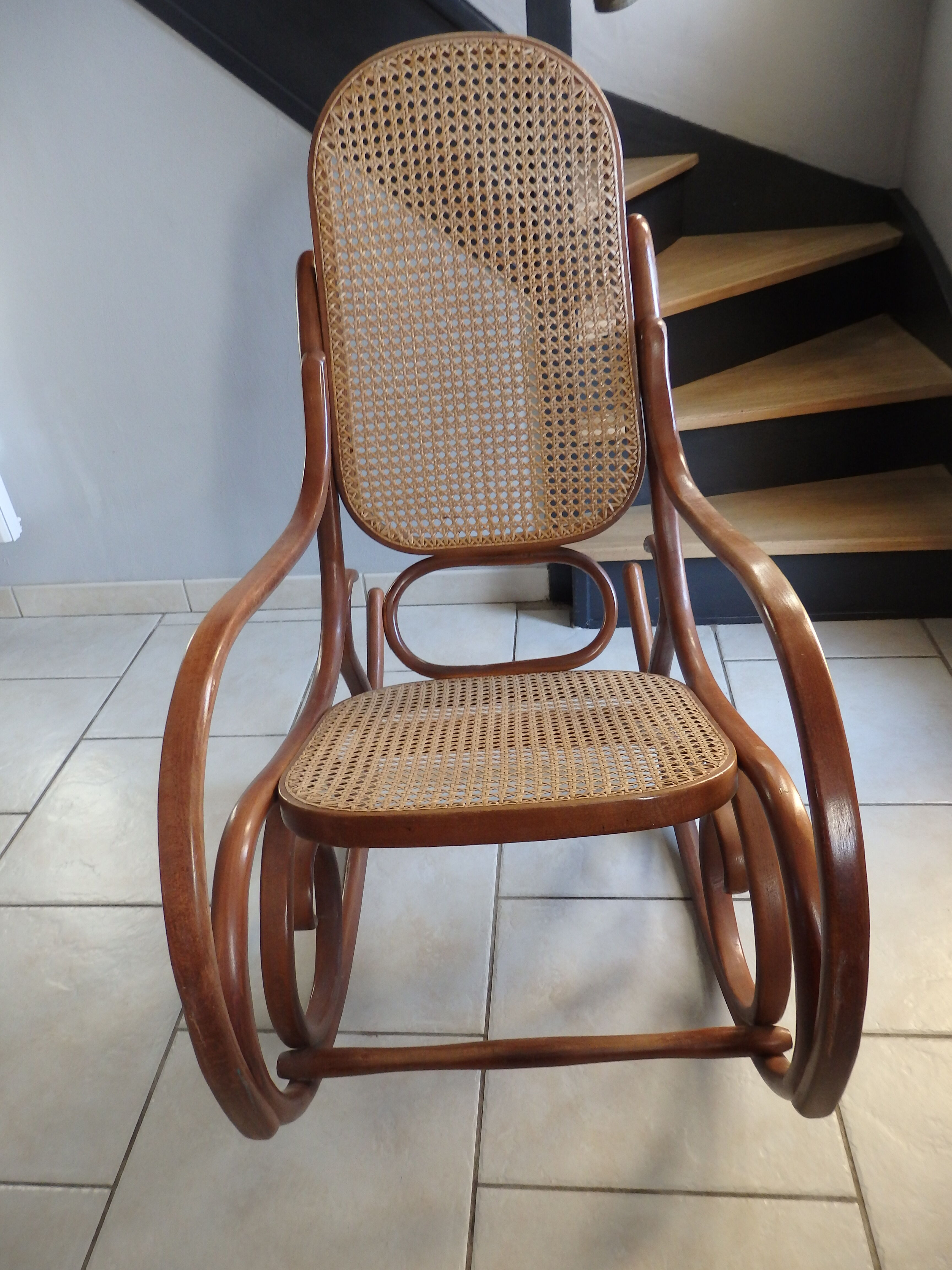 Rocking-chair in turned wood and cannage