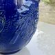 Wall pot in glazed blue terracotta with a grape design, 1970s.