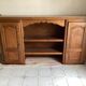Upper part of a rustic solid oak dresser with its cornice.