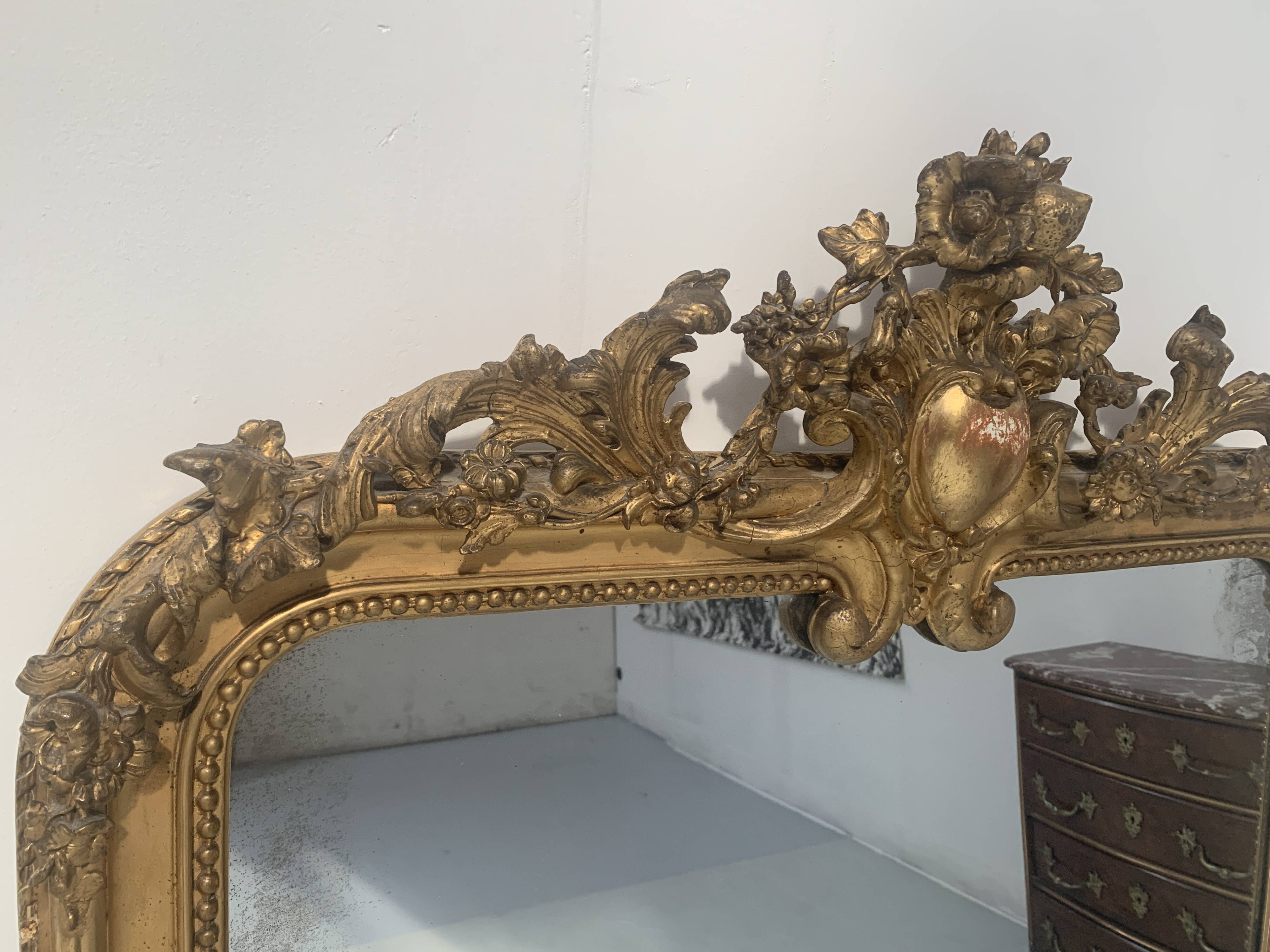 Louis XV style mirror in wood and gilded stucco, 19th century