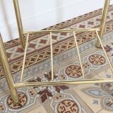 Pair of bedside tables with gold metal and mirrored glass top.