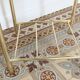 Pair of bedside tables with gold metal and mirrored glass top.