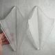Pair of Art Deco wall sconces in frosted pressed glass.