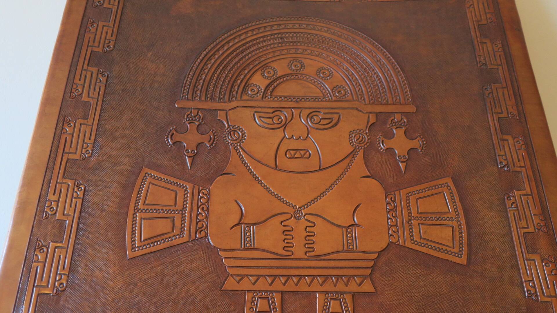 Tiahuanaco design tooled leather folding armchair by Angel Pazmino, Ecuador