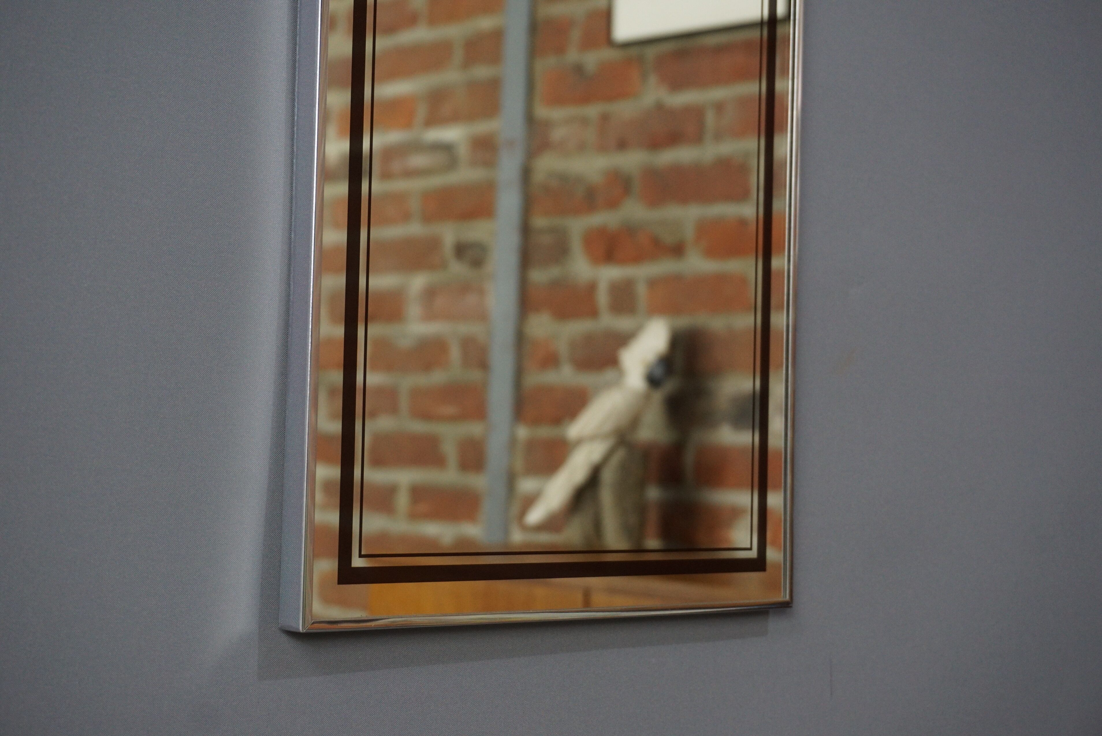 Chrome and screen-printed Deknudt mirror