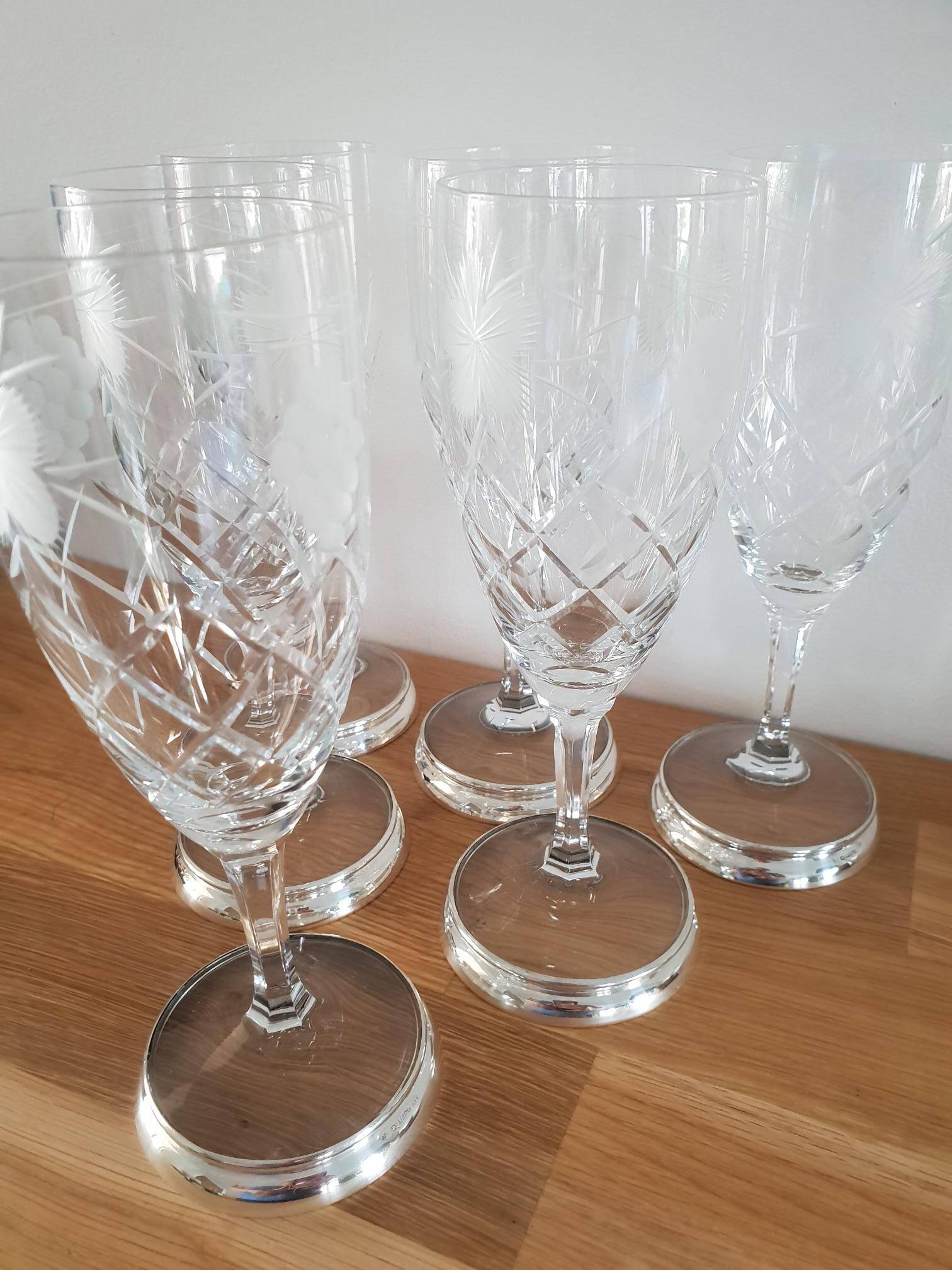 Crystal flutes with a silver rimmed foot
