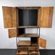 Antique wooden cabinet with black metal structure
