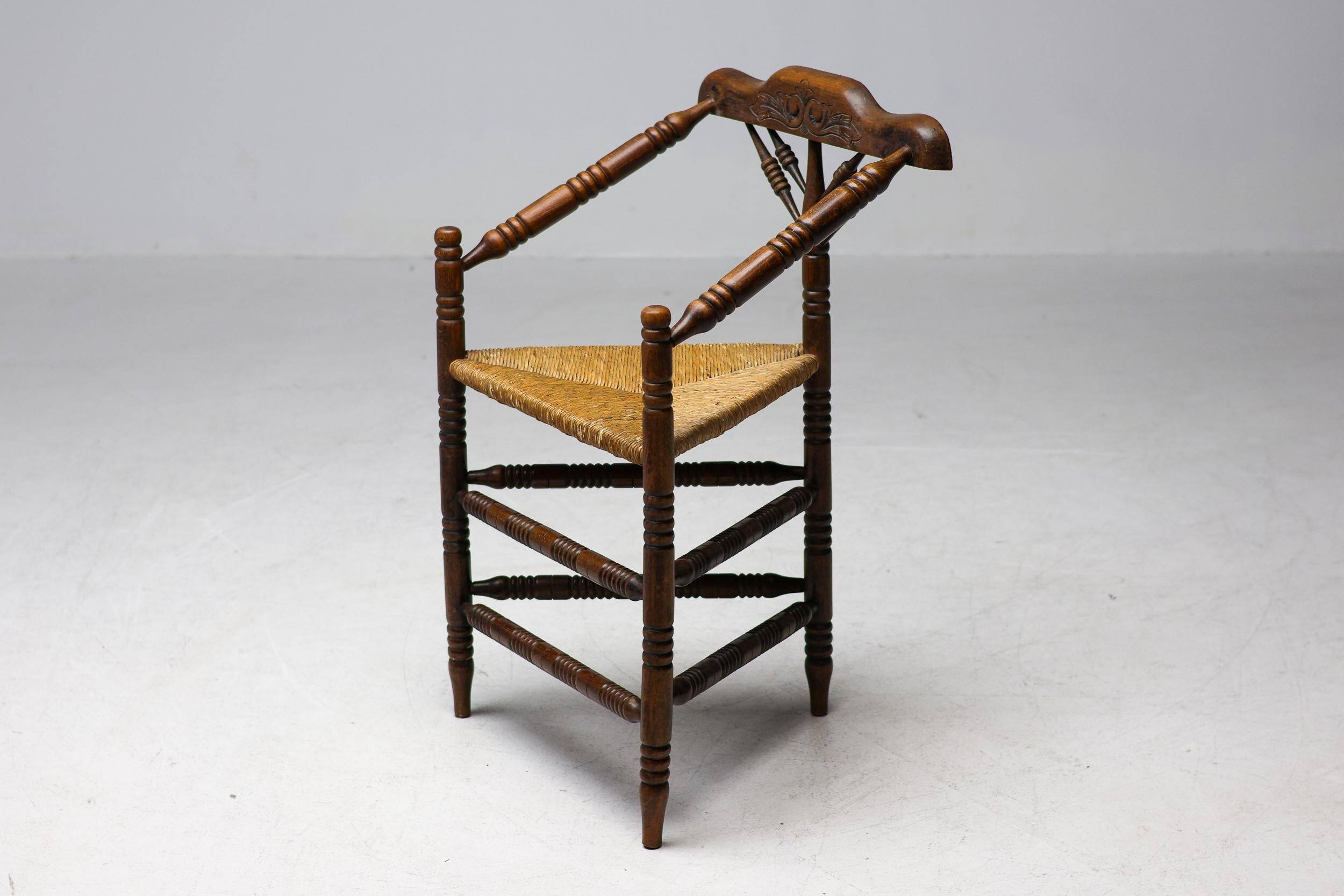Mid Century Antiques spindle wood chaise with a rush seat.