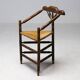 Mid Century Antiques spindle wood chaise with a rush seat.