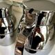 2 Hermès insulated jugs in chrome metal and covered leather.
