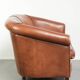 Sheepskin 2-seater sofa with a warm cognac brown colour scheme