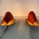 Pair of orange plexiglass and curved brass wall lights, 1950s, Germany
