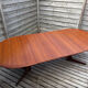 Oval teak table extendable with two leaves, Baumann style.